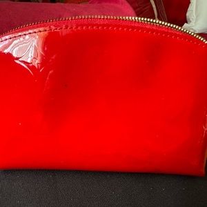 LV Vernis cosmetic case small. Small spots on outside. Check pictures.